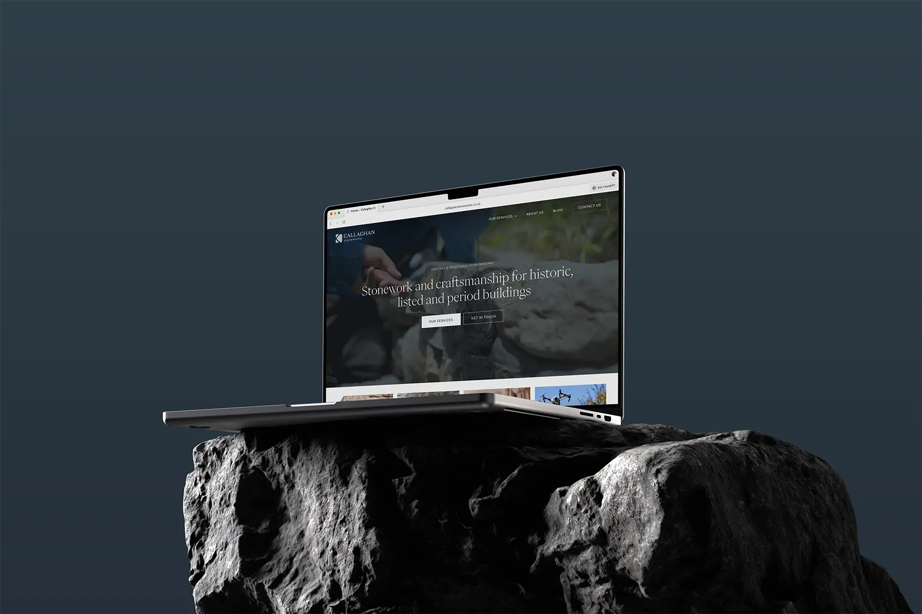 Callaghan Stoneworks, stonemasonry website displayed on MacBook on a dark stone